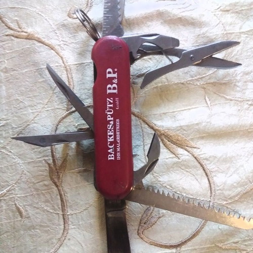 Multitool pocket knife like new, stainless steel with saw and scissors