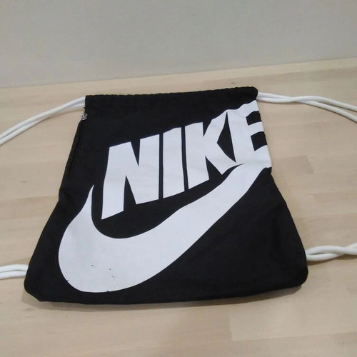 Nike unisex medium athletic drawstring bag used, black and white