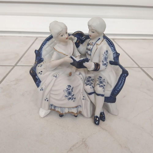 Vintage couple figurine reading on sofa rococo style like new