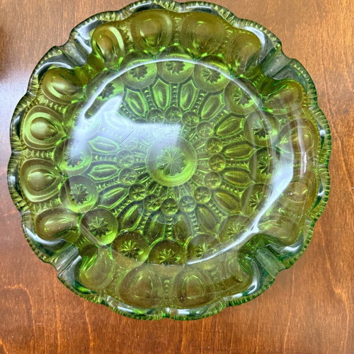 Green vintage glass plate used with embossed mid century design