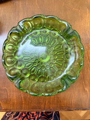 Green vintage glass plate used with embossed mid century design