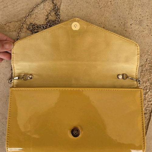 Aldo yellow vinyl clutch bag used with gold trim