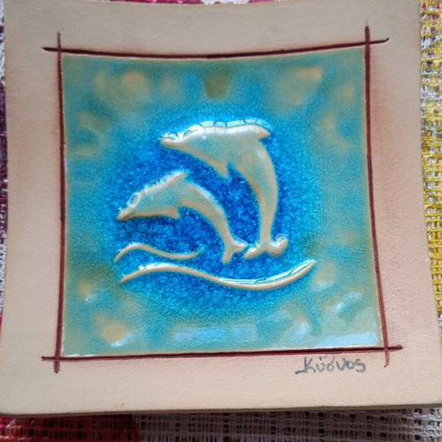 Handmade decorative plate with dolphins