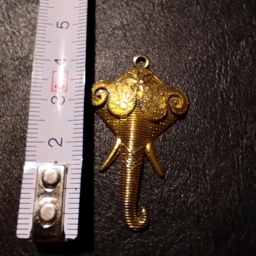 Elephant Head Pendant like new, ornate, brass, golden tone