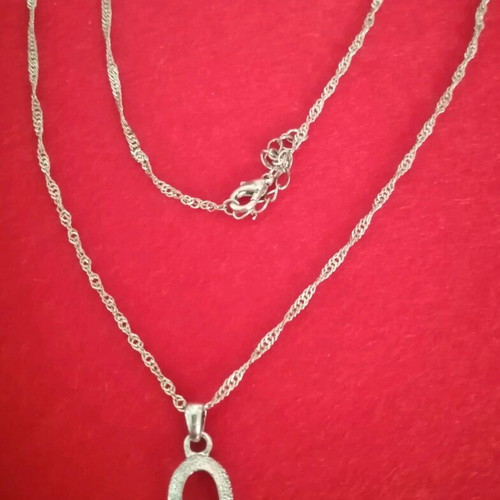 Necklace and matching earrings like new with stone, silver color
