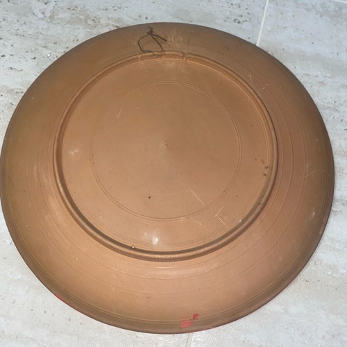 Decorative old clay plate used with minor scratches