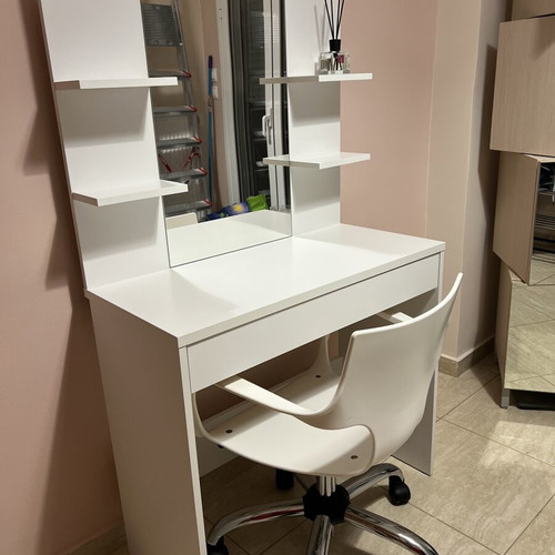 White makeup vanity table with drawer and shelves