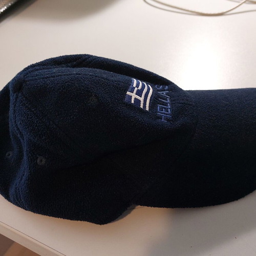 Fleece jockey hat like new, dark blue with national emblem
