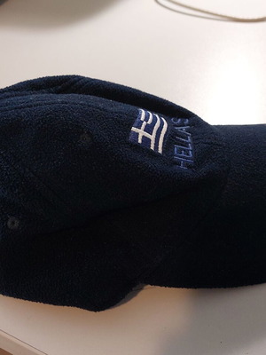 Fleece jockey hat like new, dark blue with national emblem