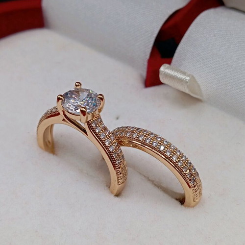 Set of solitaire ring and wedding band plated new with zircon