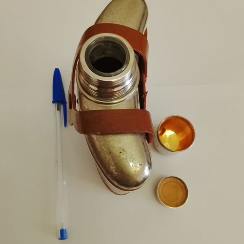 Vintage glass and metal pocket flask for alcohol in leather case used