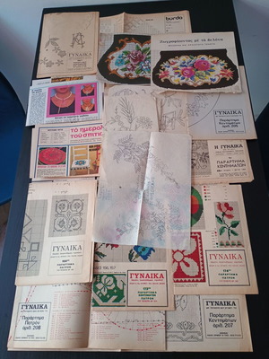 DMC and Burda embroidery patterns used, assorted