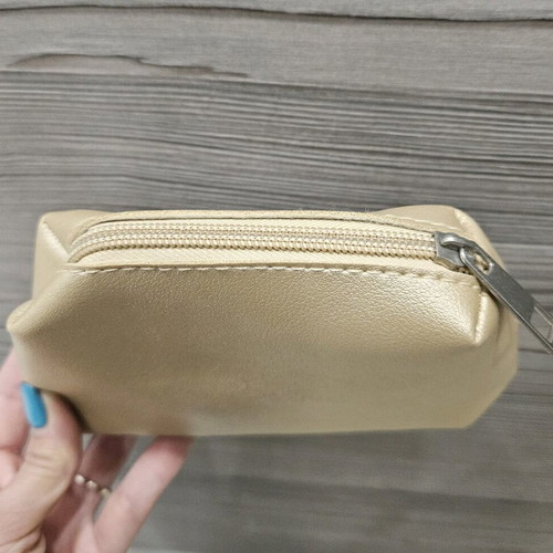 Small toiletry bags like new, gold and silver