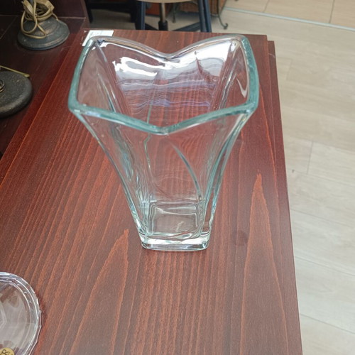 Glass decorative vase with modern wavy design, used