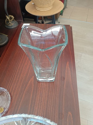 Glass decorative vase with modern wavy design, used