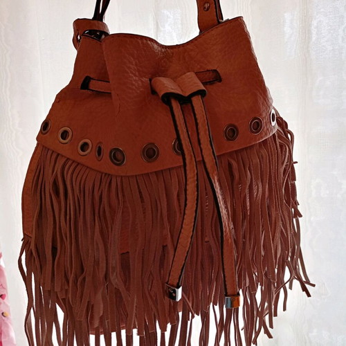 Pink shoulder bag with fringes used