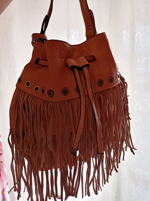 Pink shoulder bag with fringes used