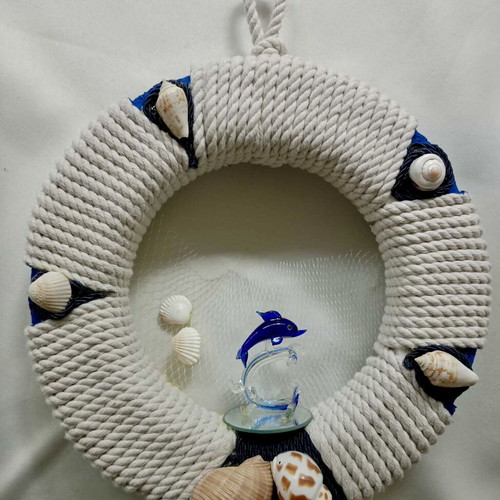Handmade decorative wreath with dolphin glass mirror and shells