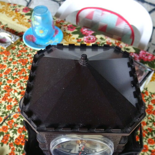 Table clock used collectible with lighting and rotating flower