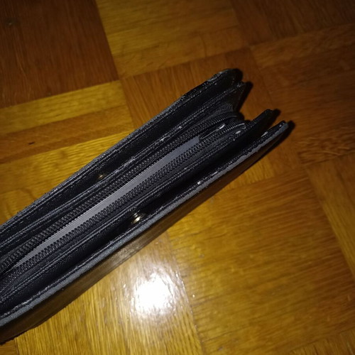 Black wallet slightly used with multiple compartments