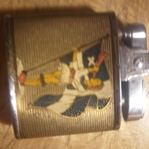 Penguin petrol lighter used, collectible