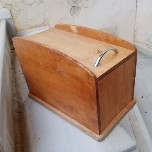 Wooden breadbox with hinged lid and metal handle used