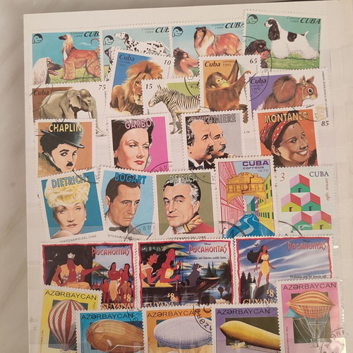 Stamp collection like new, 500+ worldwide in album