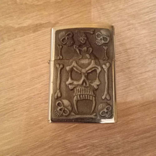 Oil lighter used carved with skull design