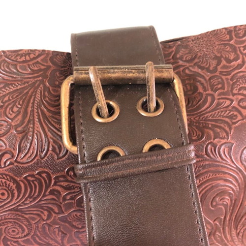Women's brown shoulder bag used with embossed design