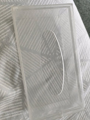 Plastic tissue box used, slightly cracked