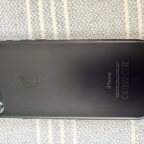 iPhone 7 with 5 cases and 3 screen protectors