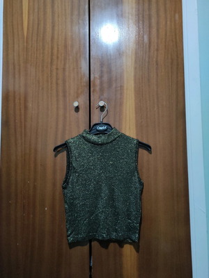 Sleeveless gold blouse used, size small
