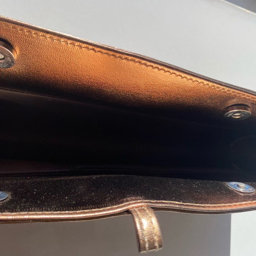 Evening hand bag like new with romantic lace decoration and copper tone