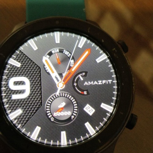 Amazfit GTR smartwatch with removable 22mm strap and charging cable
