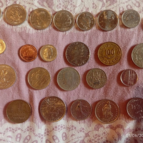 Various old coins like new from France, Canada, Tunisia, Italy, Germany, Spain