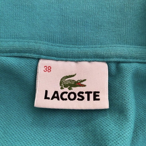 Lacoste sleeveless turquoise top, size medium