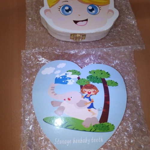 Wooden baby tooth storage boxes with boy and girl designs