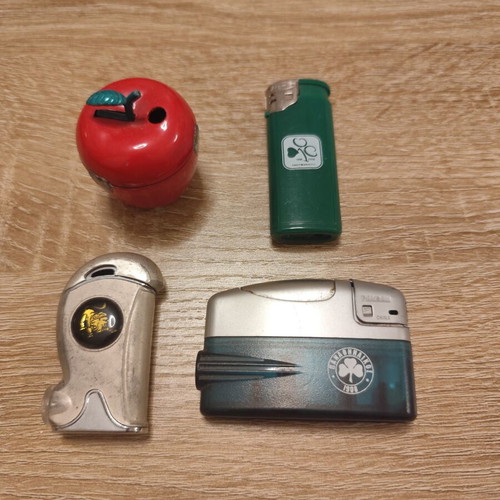 Collection of 25 used vintage lighters and 3 matchboxes from hotels and restaurants