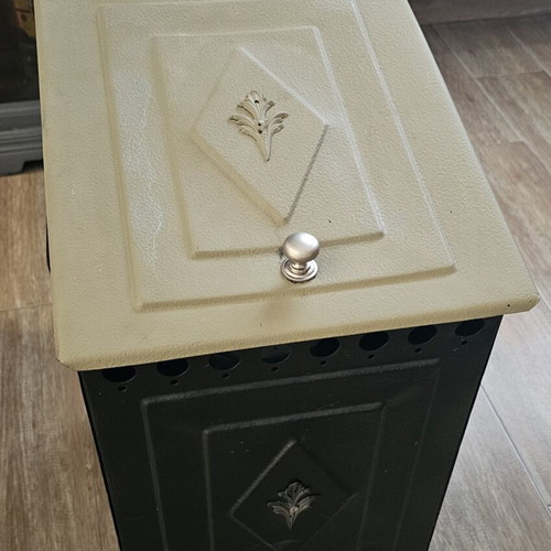 Metal wood stove used for small logs and kindling