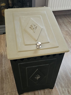 Metal wood stove used for small logs and kindling