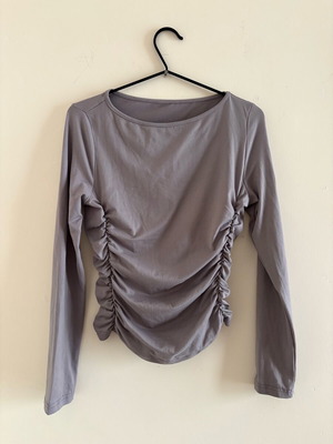 Grey top with side ruching used, size M