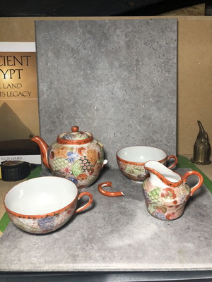 Vintage Japanese teapot with cups and saucer, broken handle