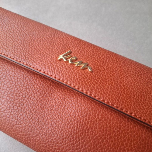 KEM wristlet clutch like new, burgundy embossed faux leather