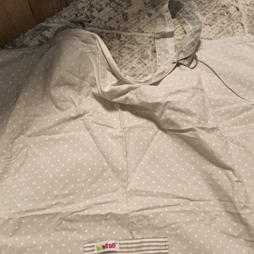 Nursing cover with storage pouch used