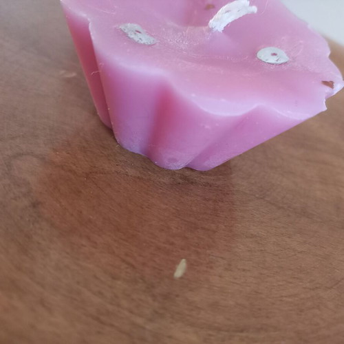 Pink candle like new, flower shape, light rose scent