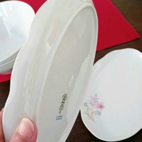 Ionia porcelain dinnerware set with floral relief decoration, 9 pieces