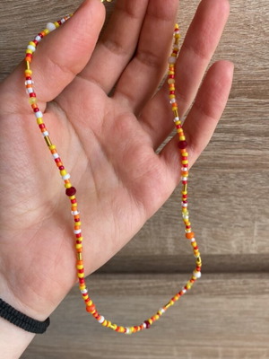 Handmade necklace colorful in red, orange and yellow