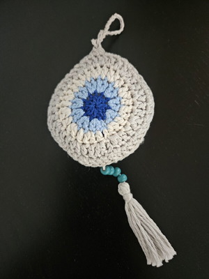 Handmade crochet evil eye charm with tassel