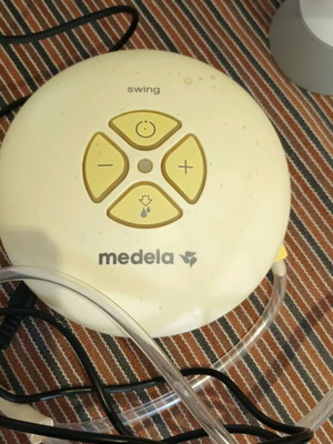 Medela Swing breast pump used, electric and battery, single with two bottles