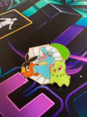 Pokemon coin pin like new with Chikorita, Tepig and Totodile
